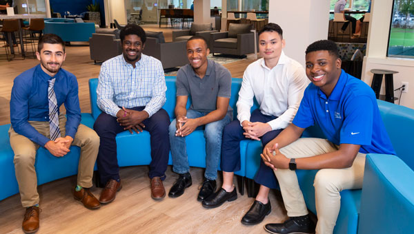A group of diverse employees posing for a picture A group of diverse employees posing for a picture